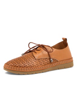 WONDERS CF TAN LEATHER
